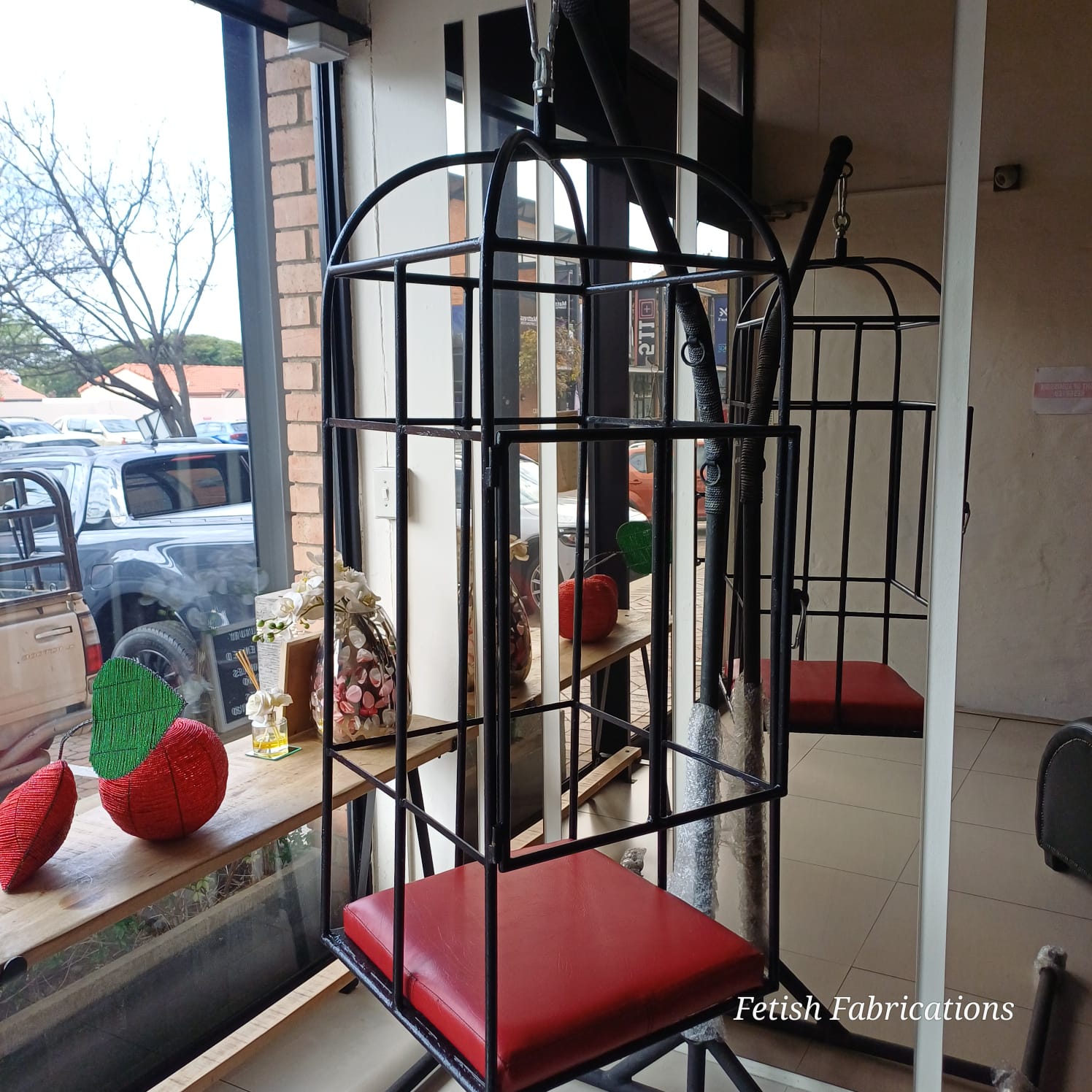 Custom steel sitting bondage cage with vinyl padded seat by Fetish Fabrications South Africa
